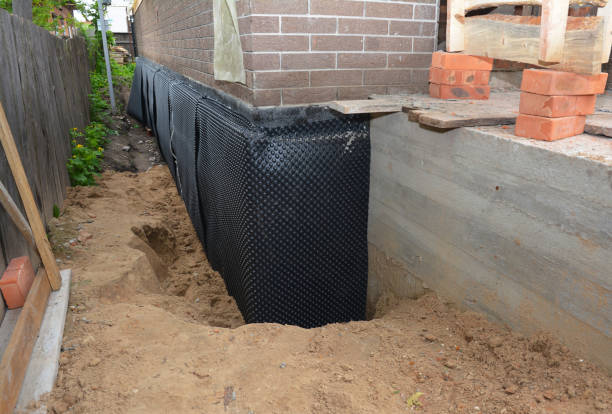 SJ Waterproofing Pros technician performing targeted Sump Pump Installation assessment in Utica, OH
